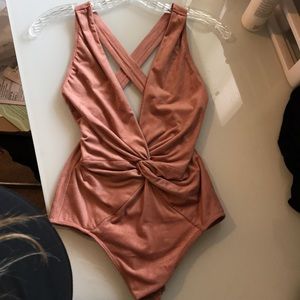 Never worn Rose colored low cut body suit